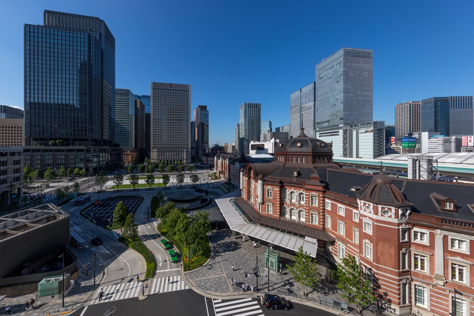 The red-brick Tokyo Station building and Marunouchi Central Plaza, ringed by office towers